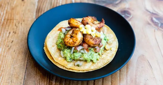 Crispy Corn Tostadas with Spiced Black Beans, Avocado and Charred Lime Crema