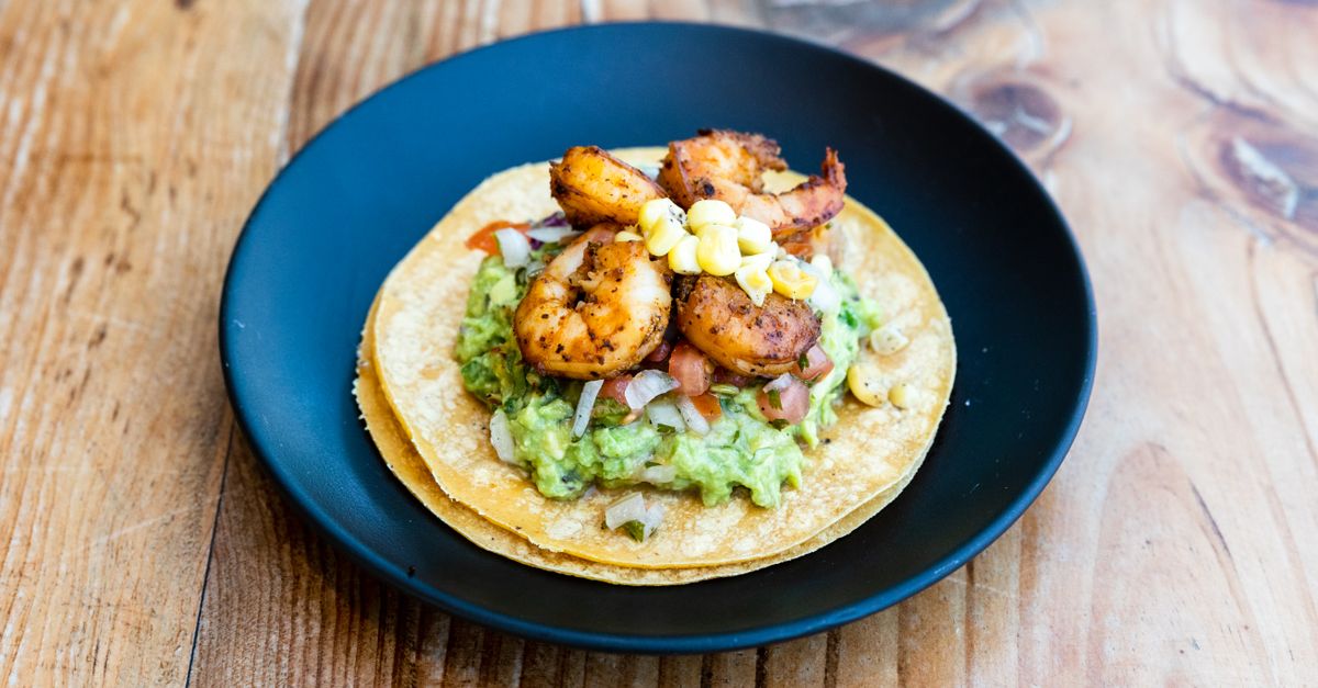 Crispy Corn Tostadas with Spiced Black Beans, Avocado and Charred Lime Crema