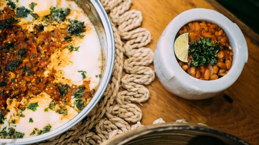 Close-up of Mexican bean dishes cooked with lime and herbs, perfect for food photography.