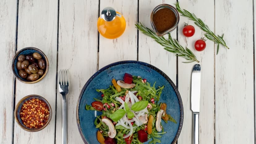 A vibrant vegetable salad with fresh ingredients, captured in an artistic flat lay.