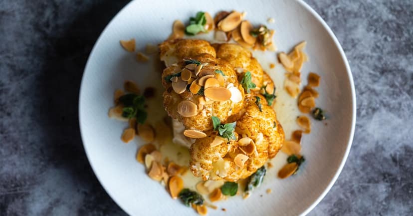Roasted Cauliflower Steaks with Pomegranate, Walnuts & Tahini Drizzle