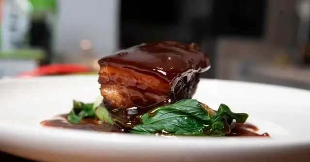 Italian Braised Pork with Creamy Polenta and Sautéed Greens