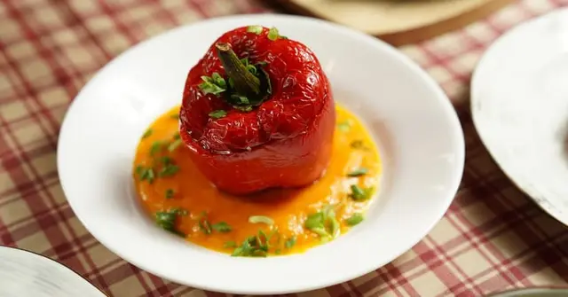 Peruvian Quinoa-Stuffed Peppers with Aji Amarillo Cream Sauce