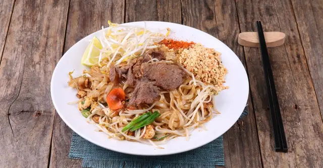 Thai-Spiced Beef Stir-Fry with Rice Noodles and Crispy Vegetables