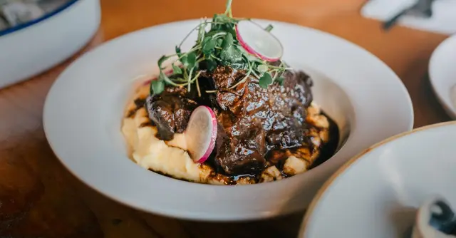 Braised Beef Shin with Tomato, Olives and Roasted Root Vegetables