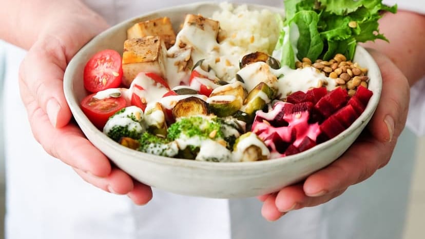 Close-up of a fresh vegetable salad bowl with tofu, perfect for a nutritious meal.