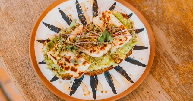 Mexican-Style Grilled Halloumi with Charred Corn, Black Beans & Lime Crema