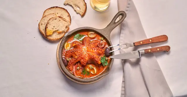Braised Octopus with Cannellini Beans, Tomato & Rosemary